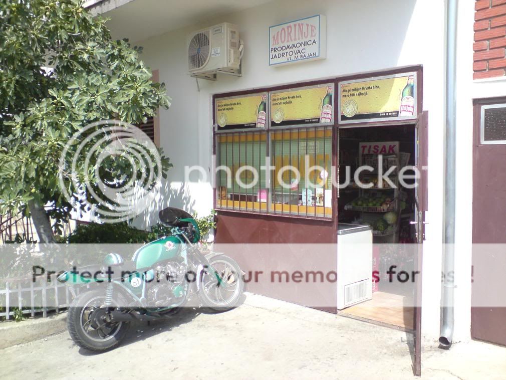 Motorcycle Travel Adventure Cafe Racer outside the store